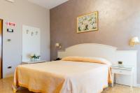 Posteľ alebo postele v izbe v ubytovaní Hotel Riviera