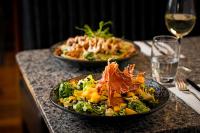 a table with two plates of food on a table at George Limerick Hotel in Limerick
