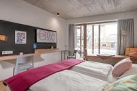 Łóżko lub łóżka w pokoju w obiekcie Hotel Blü Gastein