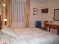 Postel nebo postele na pokoji v ubytování Hotel Llacs De Cardos