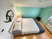 Łóżko lub łóżka w pokoju w obiekcie Villa Palma Rovinj