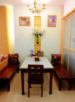 a dining room with a table and two benches at Spring Garden Homestay in Hualien City