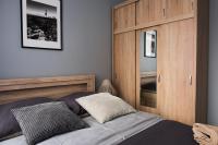 Posteľ alebo postele v izbe v ubytovaní Apartamenty France Faktura VAT