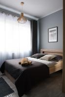 Posteľ alebo postele v izbe v ubytovaní Apartamenty France Faktura VAT