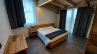 Posteľ alebo postele v izbe v ubytovaní Albergo Alpino
