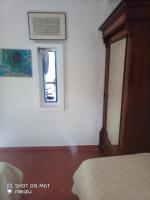 A bed or beds in a room at Ferienhaus Panorama, San Teodoro, Isuledda