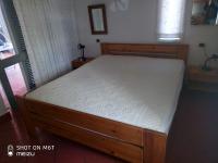 A bed or beds in a room at Ferienhaus Panorama, San Teodoro, Isuledda
