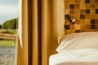 Postel nebo postele na pokoji v ubytování Hotel Dymník