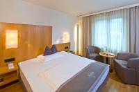 Łóżko lub łóżka w pokoju w obiekcie Hotel Maximilian - Stadthaus Penz