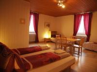 Postel nebo postele na pokoji v ubytování Hôtel Garni Villa Carmen