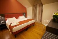 A bed or beds in a room at Hotel Concord