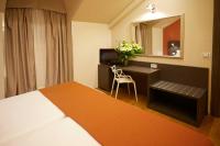 A bed or beds in a room at Hotel Concord