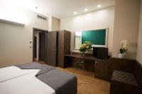 A bed or beds in a room at Hotel Concord