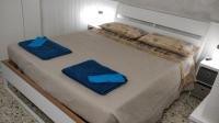 A bed or beds in a room at La Luna nel Parco