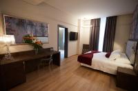 A bed or beds in a room at Hotel Concord