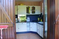 a kitchen with white cabinets and a sink at Maison de 2 chambres avec jardin clos et wifi a Marcillac la Croisille in Marcillac-la-Croisille