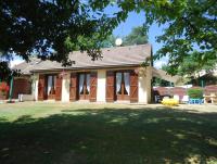 a house with a large yard in front of it at Maison de 2 chambres avec jardin clos et wifi a Marcillac la Croisille in Marcillac-la-Croisille