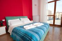 A bed or beds in a room at Leccesalento Bed And Breakfast