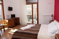 A bed or beds in a room at Leccesalento Bed And Breakfast