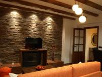 TV a/nebo společenská místnost v ubytování Apartamentos Rurales El Palomar