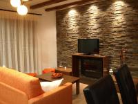 TV a/nebo společenská místnost v ubytování Apartamentos Rurales El Palomar