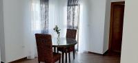 a dining room with a table and chairs and a window at TIM Haute standing appartment S2, center Monastir in Monastir