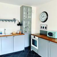 A kitchen or kitchenette at APARTELLO Modern Apartment - Balkan Breeze 7