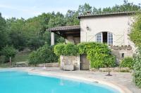 a house with a swimming pool in front of a house at Maison de 2 chambres avec piscine privee jardin amenage et wifi a Bruniquel in Bruniquel