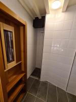 a shower stall in a bathroom with a door at Rijksmonument Havenzicht, met zeezicht, ligging direct aan zee en centrum in Vlissingen