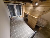 an overhead view of a room with a bed and a desk at Rijksmonument Havenzicht, met zeezicht, ligging direct aan zee en centrum in Vlissingen