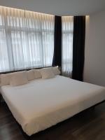 Cama o camas de una habitación en Hotel Lux Santiago
