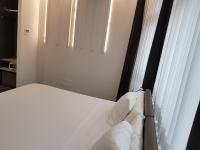 Cama o camas de una habitación en Hotel Lux Santiago