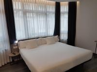 Cama o camas de una habitación en Hotel Lux Santiago