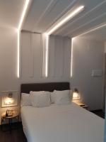 Cama o camas de una habitación en Hotel Lux Santiago