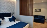 A bed or beds in a room at Duomo Hotel & Apartments