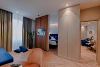 A bed or beds in a room at Duomo Hotel & Apartments