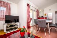 Televízia a/alebo spoločenská miestnosť v ubytovaní Apartments City View