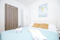 Posteľ alebo postele v izbe v ubytovaní Apartments City View