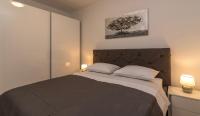 Posteľ alebo postele v izbe v ubytovaní Apartments City View