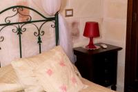 Posteľ alebo postele v izbe v ubytovaní Relais Villa Lucia