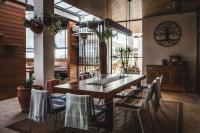 a dining room with a wooden table and chairs at Shoreline Hotel in Hobart