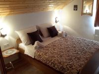 a bedroom with a large bed in a room at Lake House 1 in Plitvička Jezera