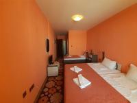 A bed or beds in a room at Gelov Hotel