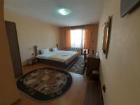 A bed or beds in a room at Gelov Hotel