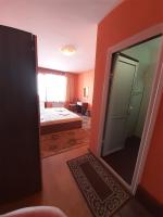 A bed or beds in a room at Gelov Hotel