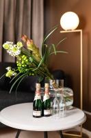 two bottles of champagne on a table with wine glasses at Hotel Sparre in Porvoo