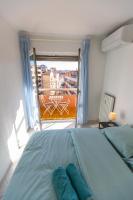 a bedroom with a bed and a large window at Superbe 100m2 - 2 Balcons - Proche Gare - Climatisé in Marseille
