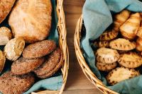 two baskets filled with different types of bread at Hotel Sparre in Porvoo