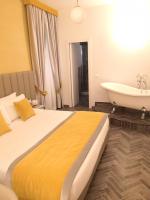 Posteľ alebo postele v izbe v ubytovaní Frattina FF italian suites
