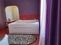 A bed or beds in a room at Gelov Hotel